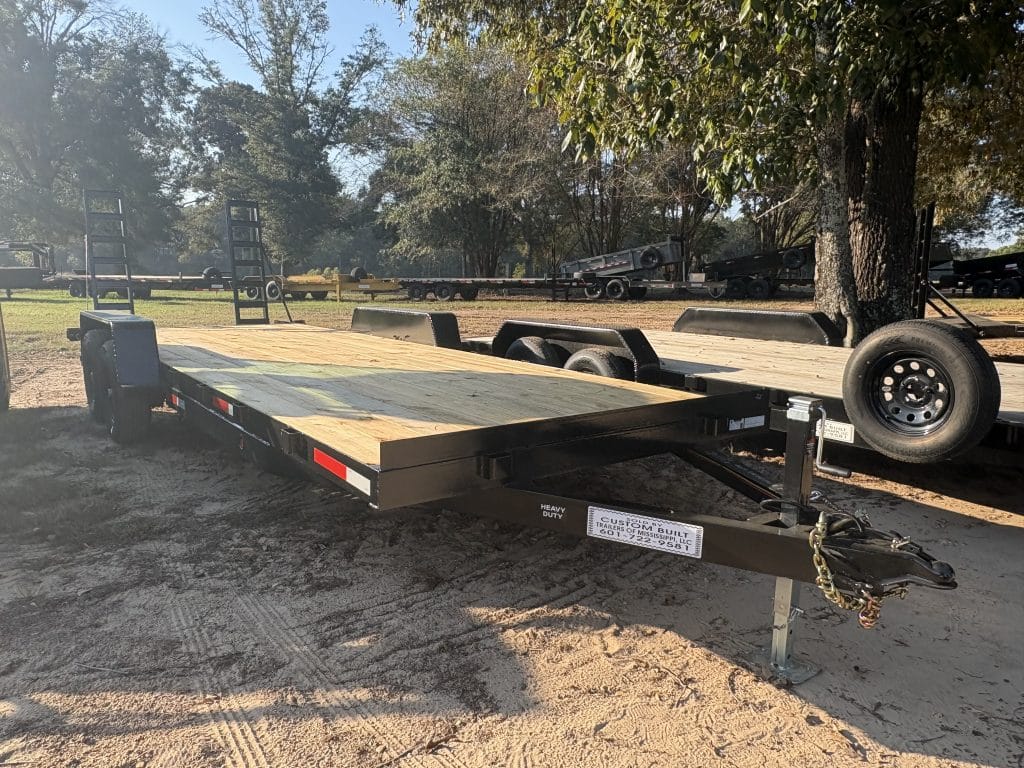 Car hauler trailer interior showing deck and side rails