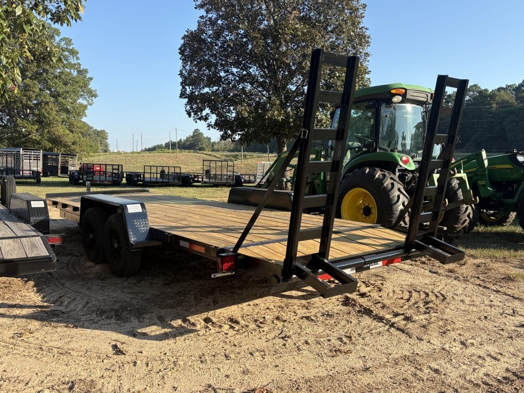 Heavy-duty car hauler trailer with dual axles and ramps