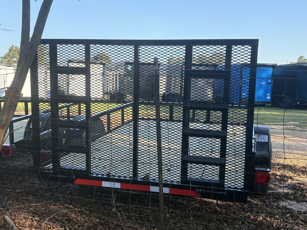 Small utility trailer with loading gate and frame